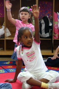 Kids raising hands